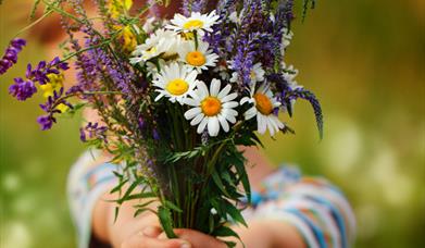 child with bunch of flowers