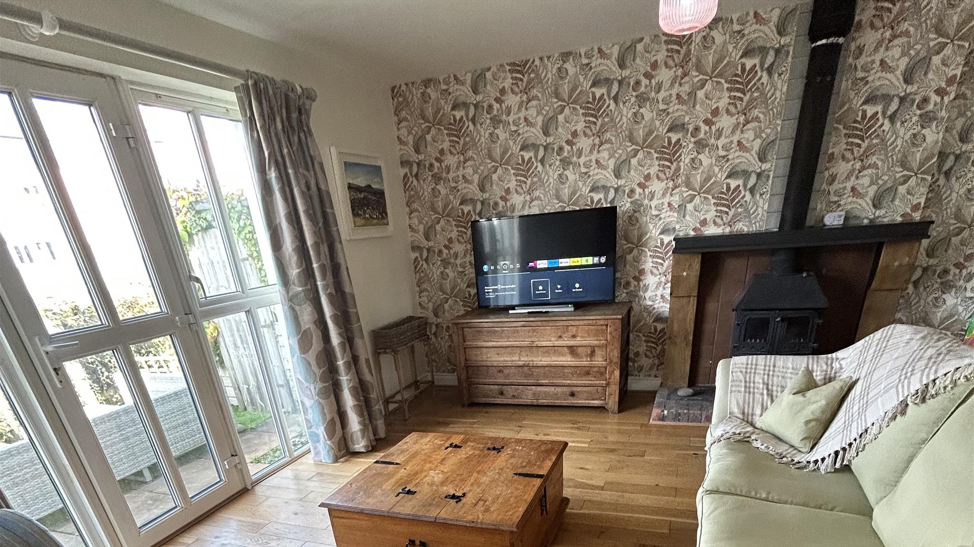 living room with fireplace and tv