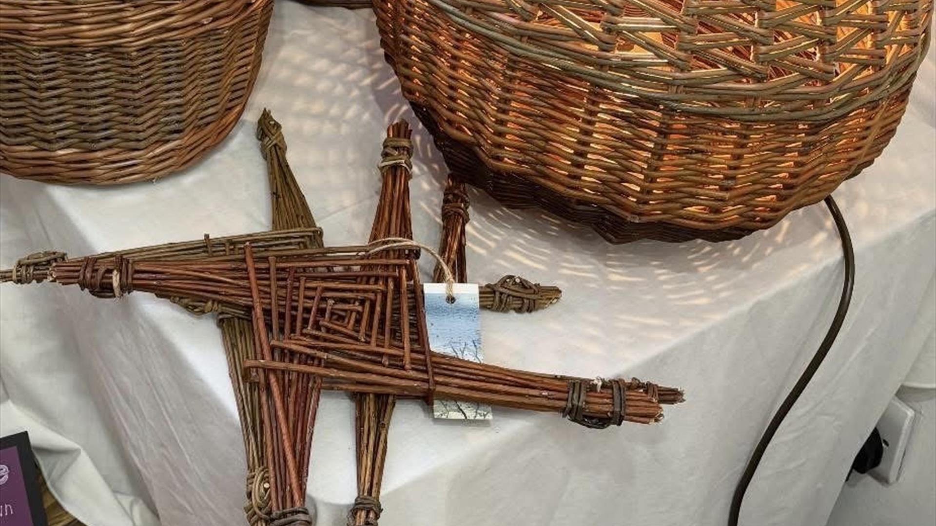 Two woven St Brigid's Crosses as well as some more examples of traditional weaving and basketry