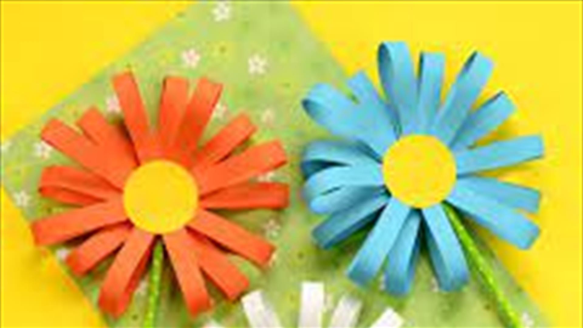 Three daisy flowers made out of paper