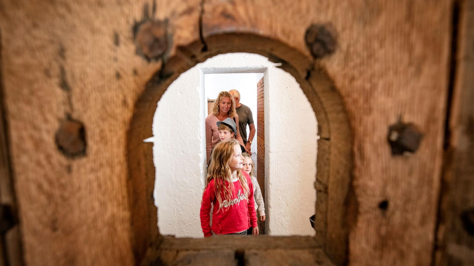 Family exploring restored Gaol cells at Down County Museum
