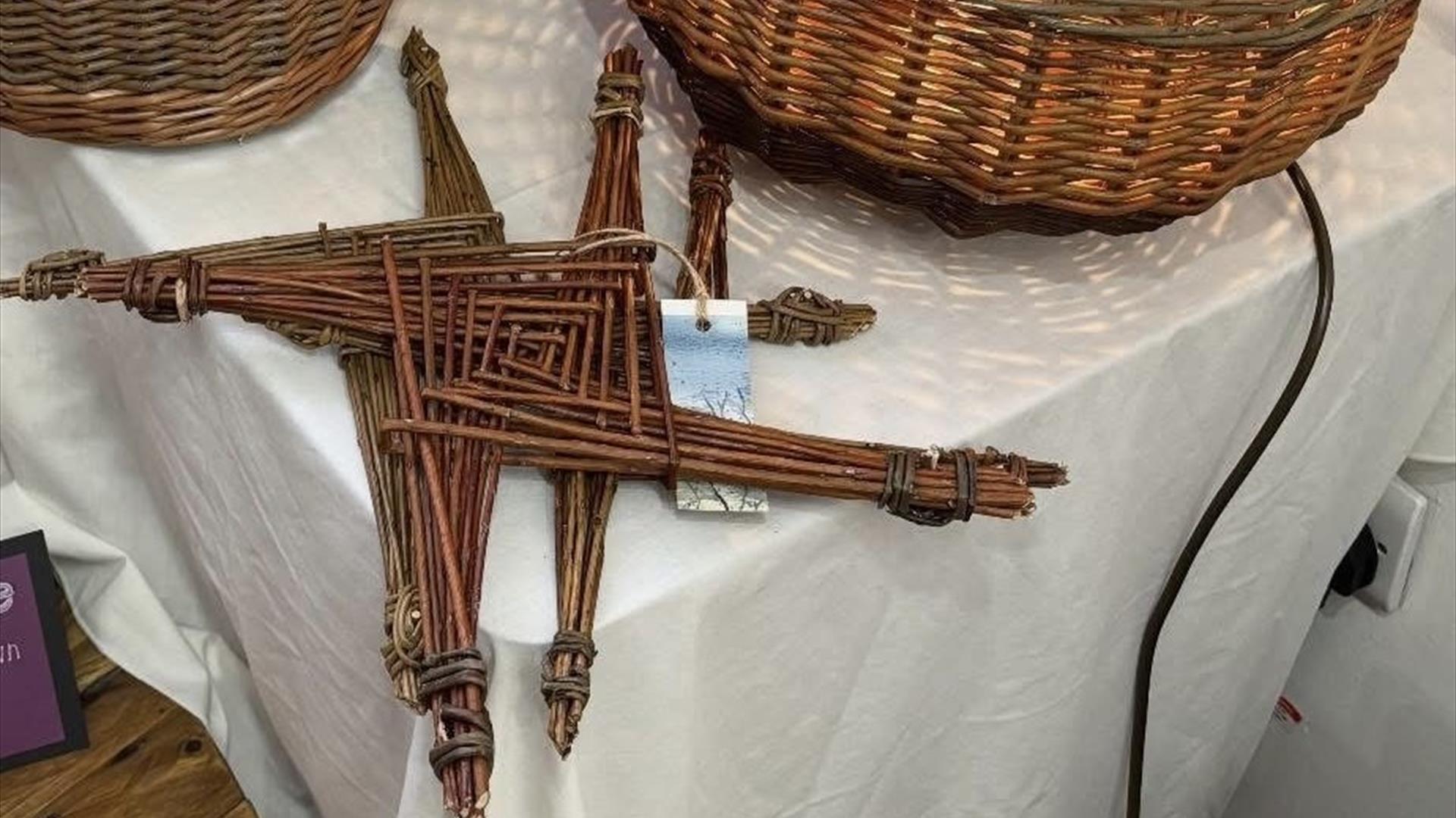 Two woven St Brigid's Crosses as well as some more examples of traditional weaving and basketry.