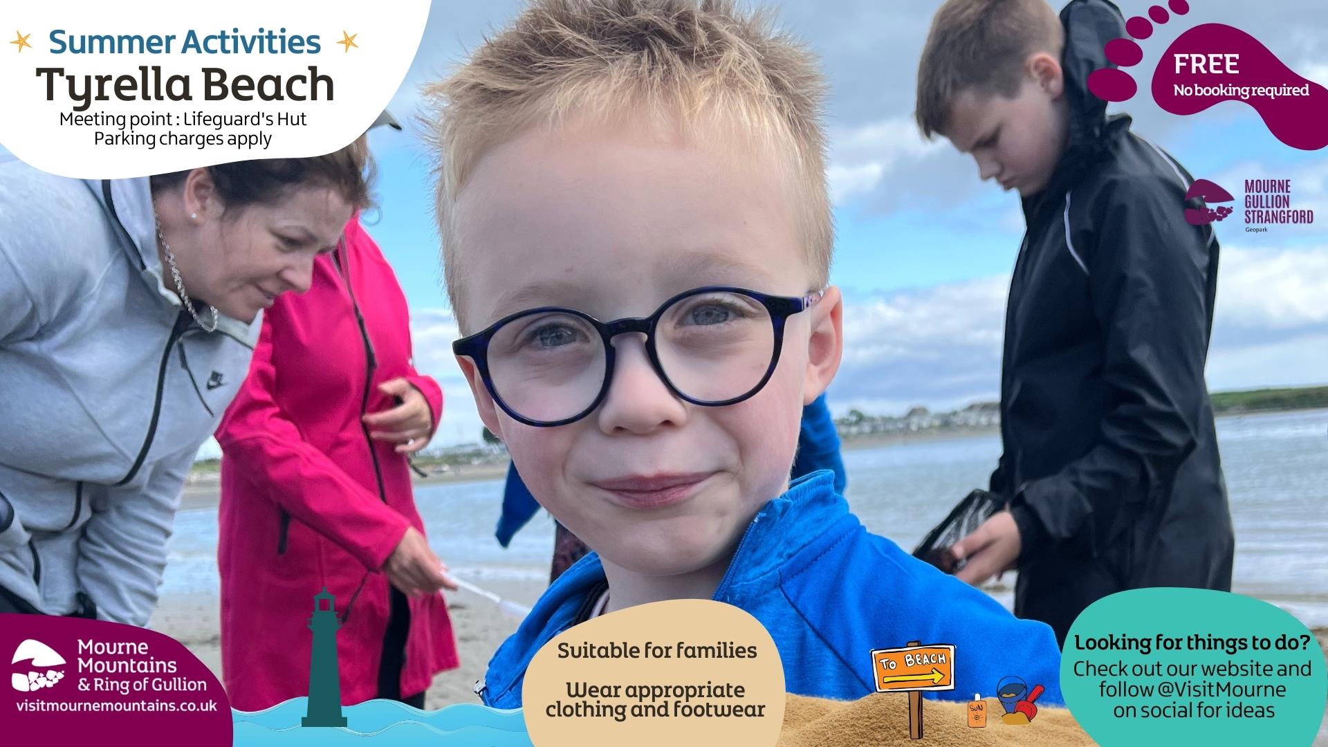 Upclose picture of a boy enjoying beach activities with three people in the background exploring a rock pool.