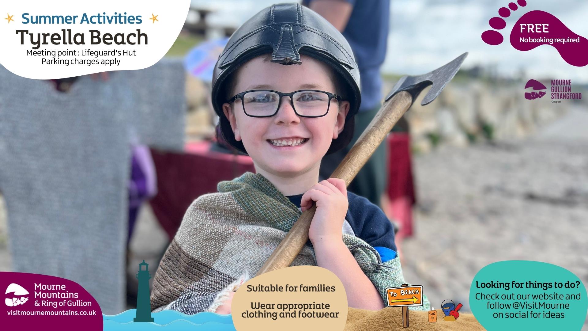 A boy dressed as a viking enjoying beach activities