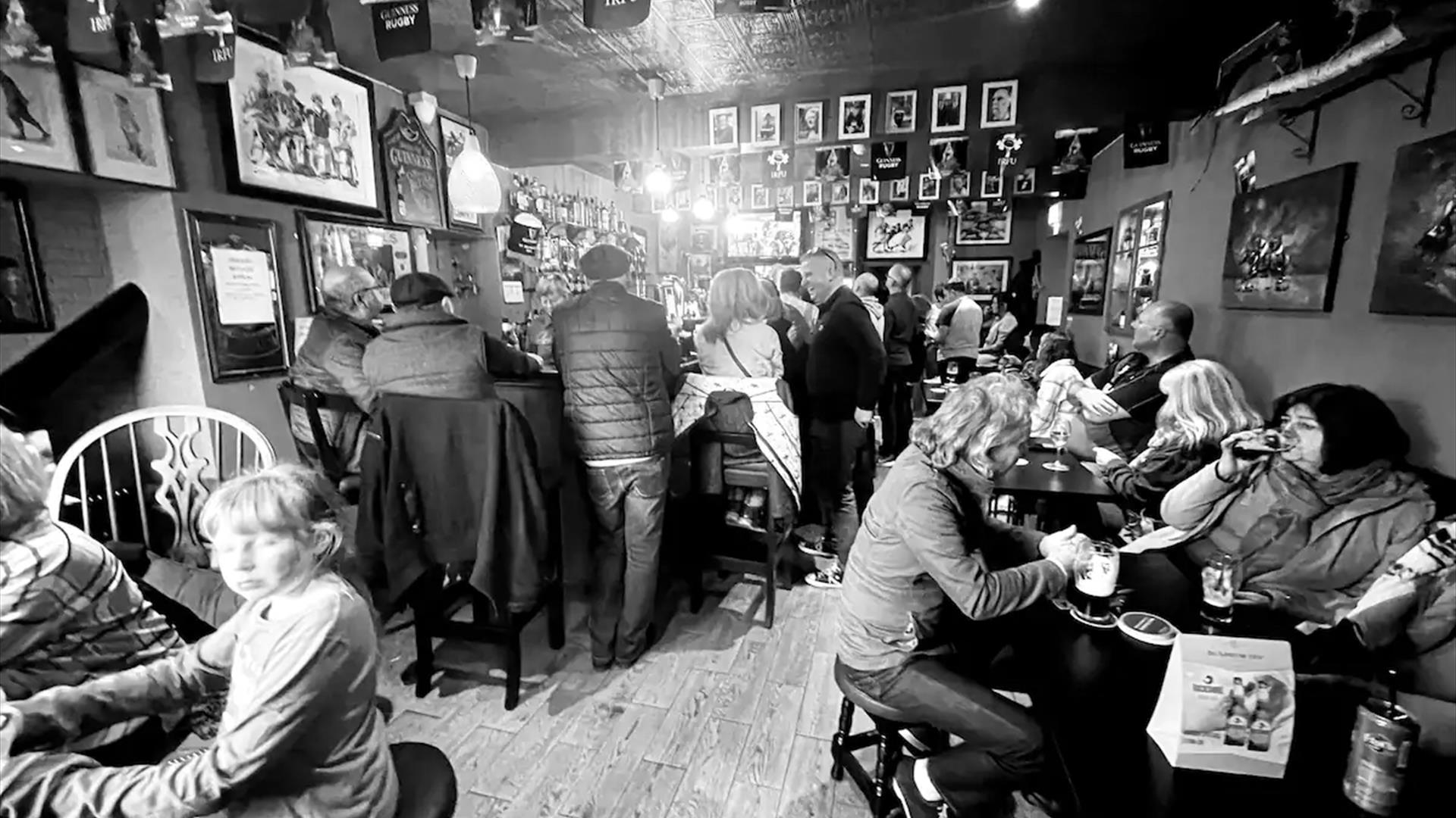 Bar with people drinking at tables