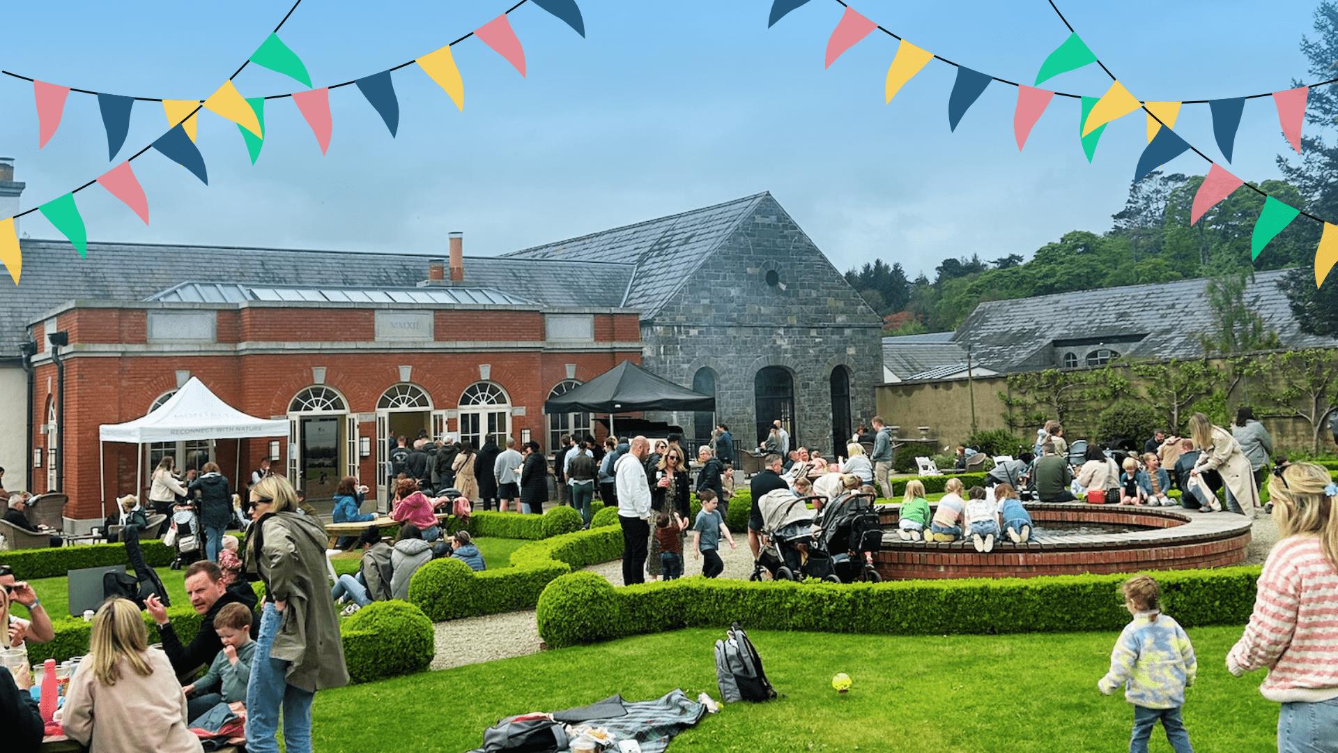 Event in the Walled Garden, Montalto with lots of people and bunting