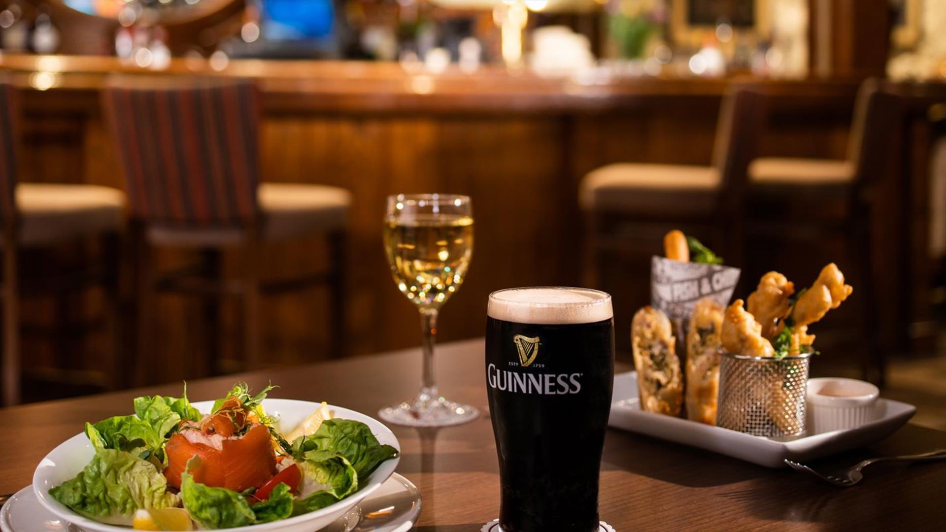 Food wine and Guinness on table