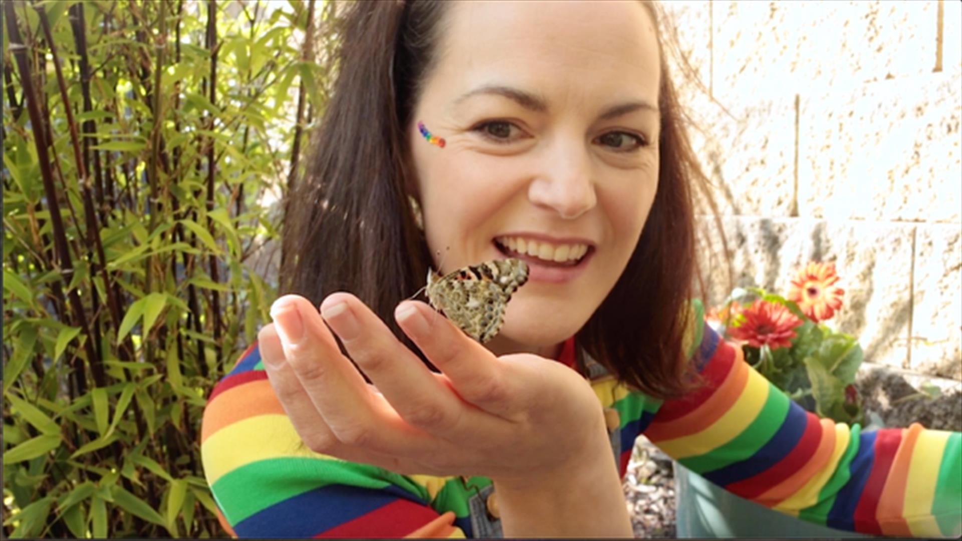 Bop holding a butterfly