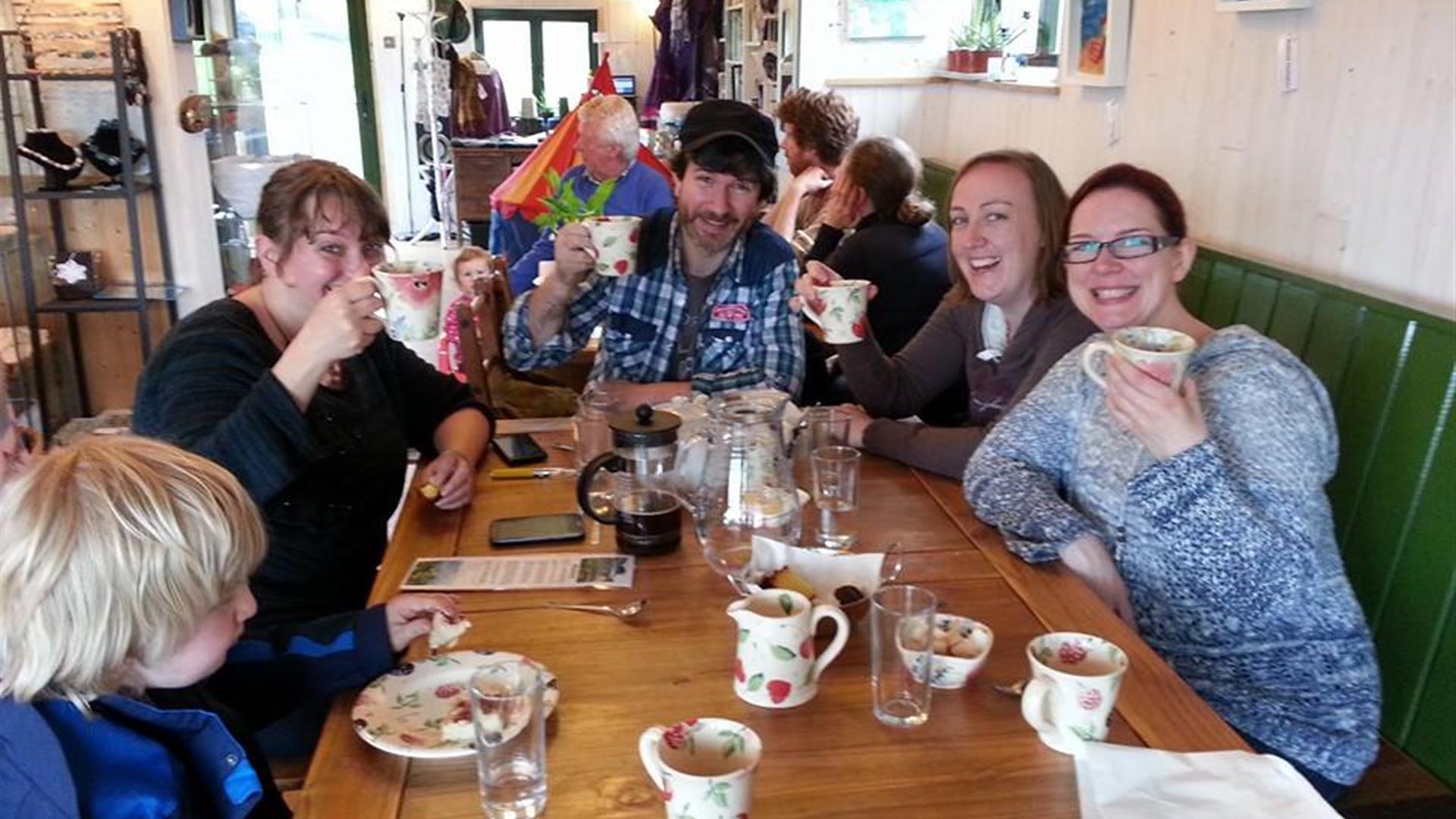 Group of friends at table enjoying food