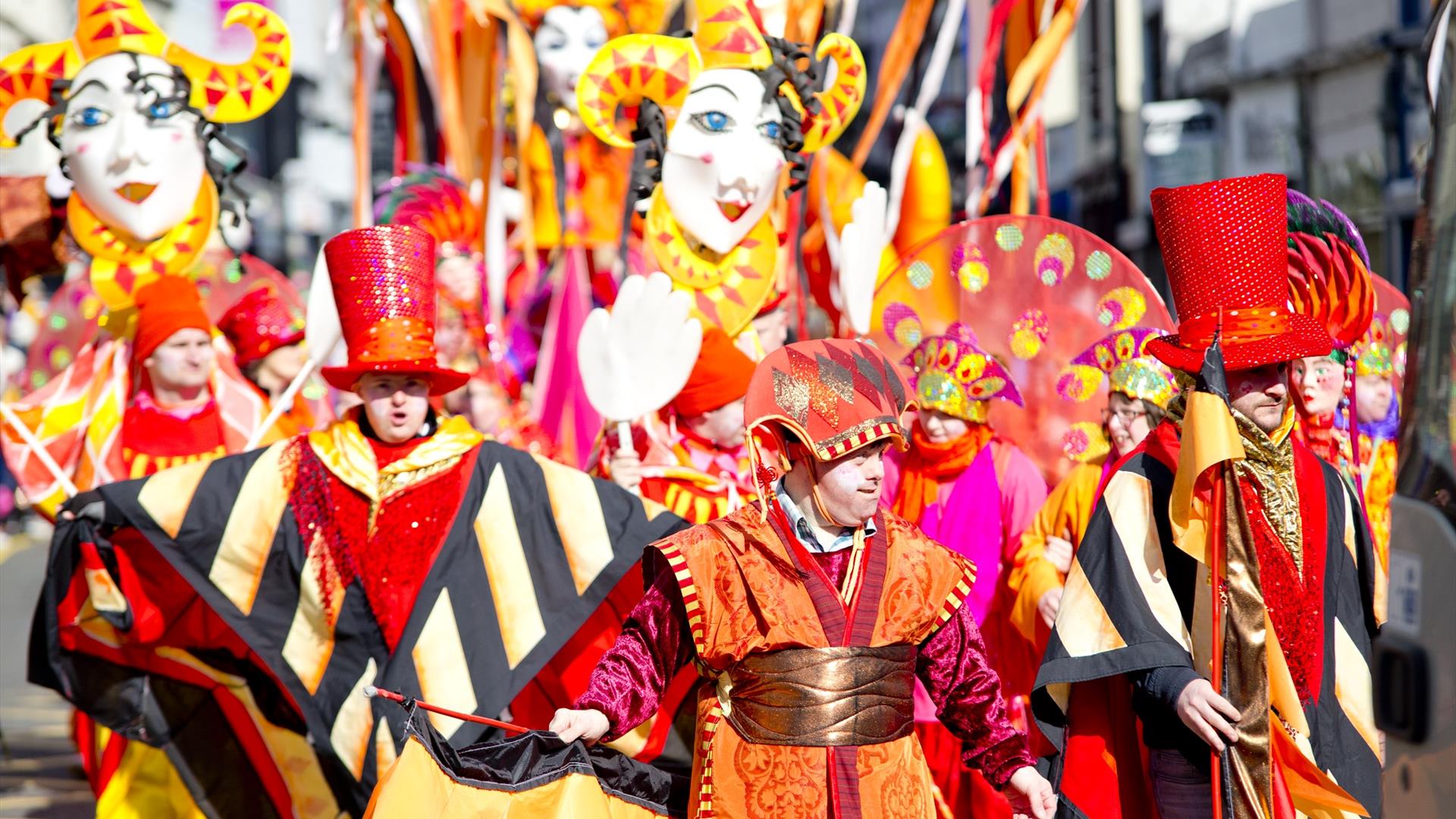 Performers walking down Market Street in Downpatrick as part of the St Patrick's Day parade.