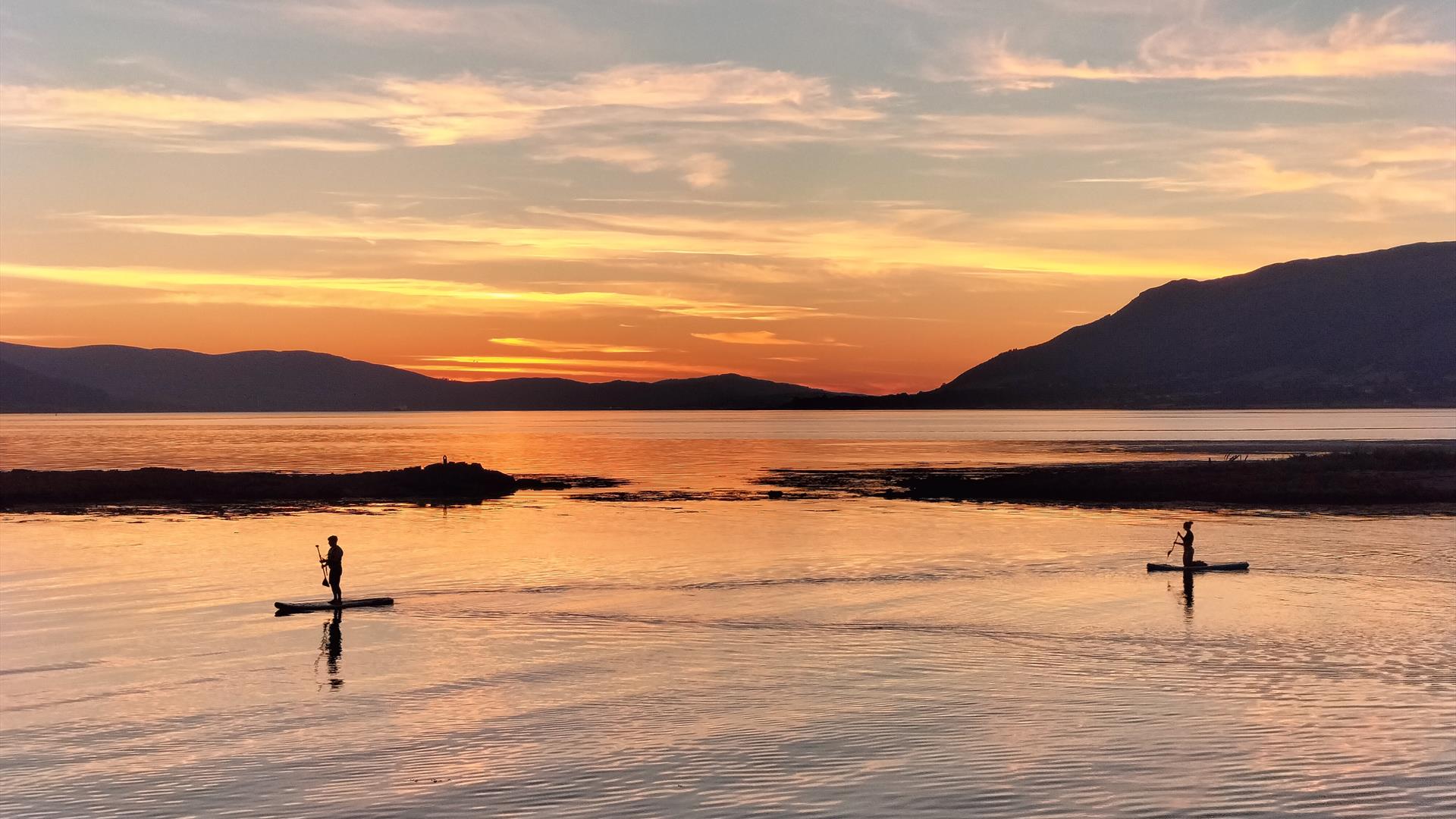 Enjoying the pure bliss of the sunset at Greencastle on the sunset SUP experience
