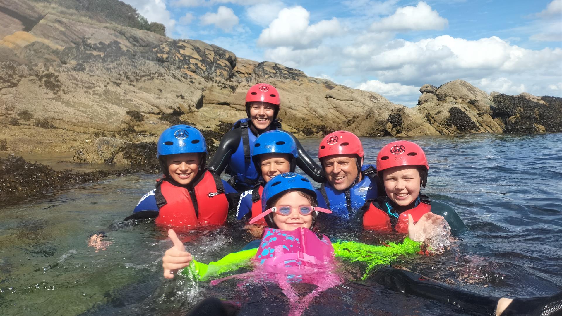 Family enjoying the water (wet bouldering) on a bank holiday