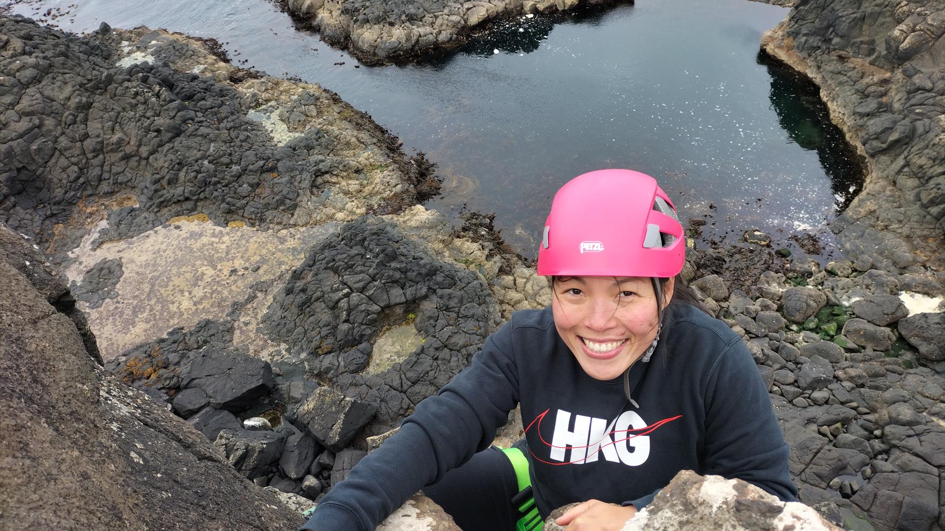 Getting to the top on an amazing sea cliff rock climb!