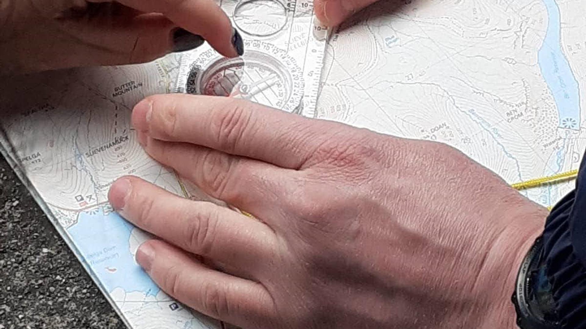 Compass practice on navigation skills course in the Mournes
