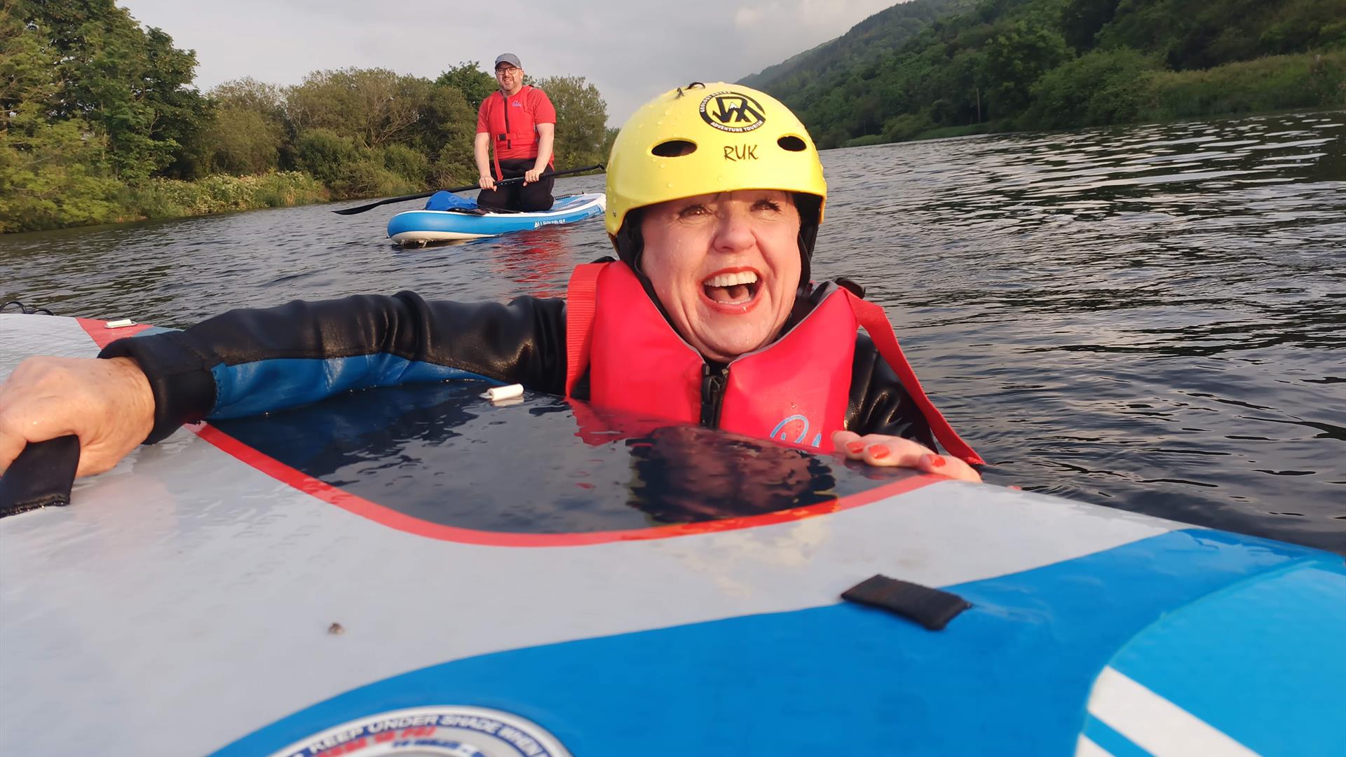 Woman smiling on a great paddle board session - Carlingford Lough