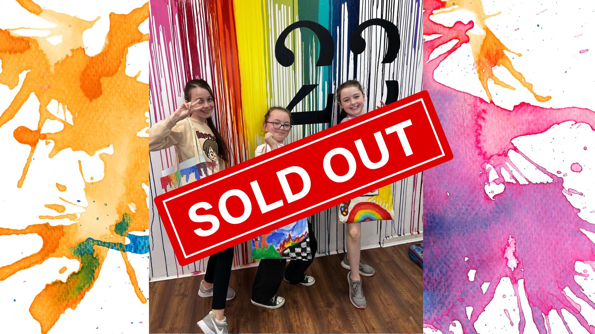 Children holding up tote bags they designed at Studio 23 for Newry Arts Festival.