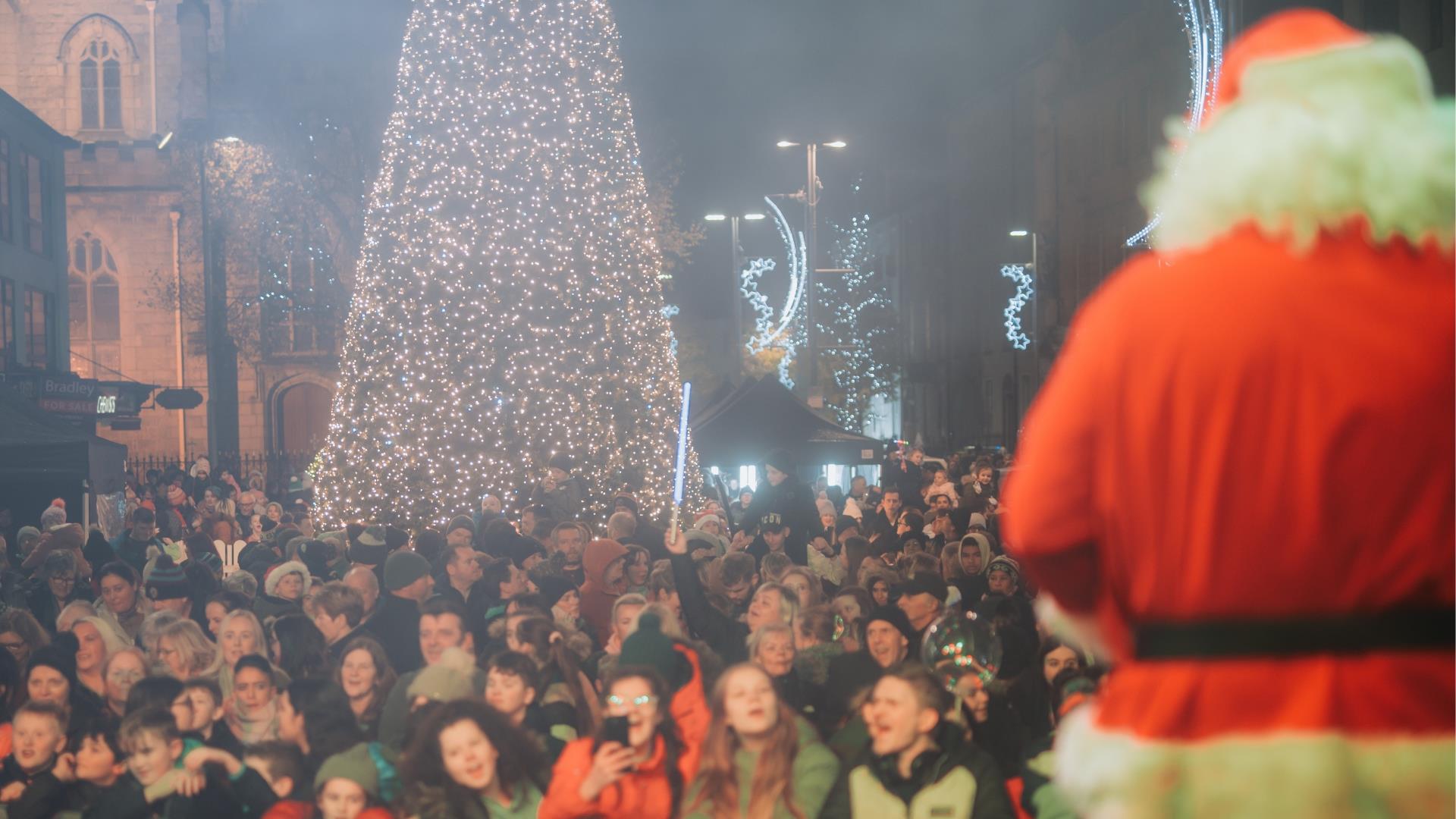 Santa switching on the Christmas tree lights in Newry City