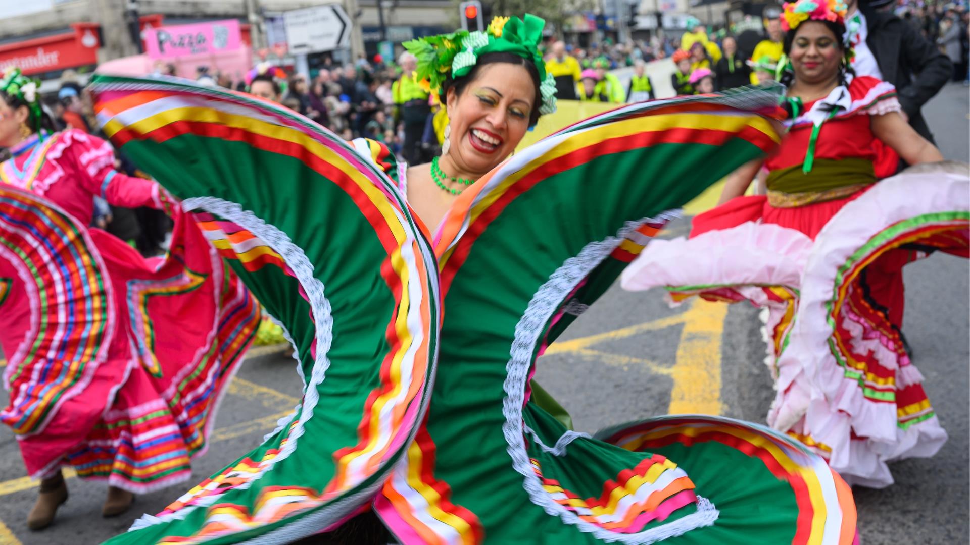 Performers walking down Market Street in Downpatrick as part of the St Patrick's Day parade.