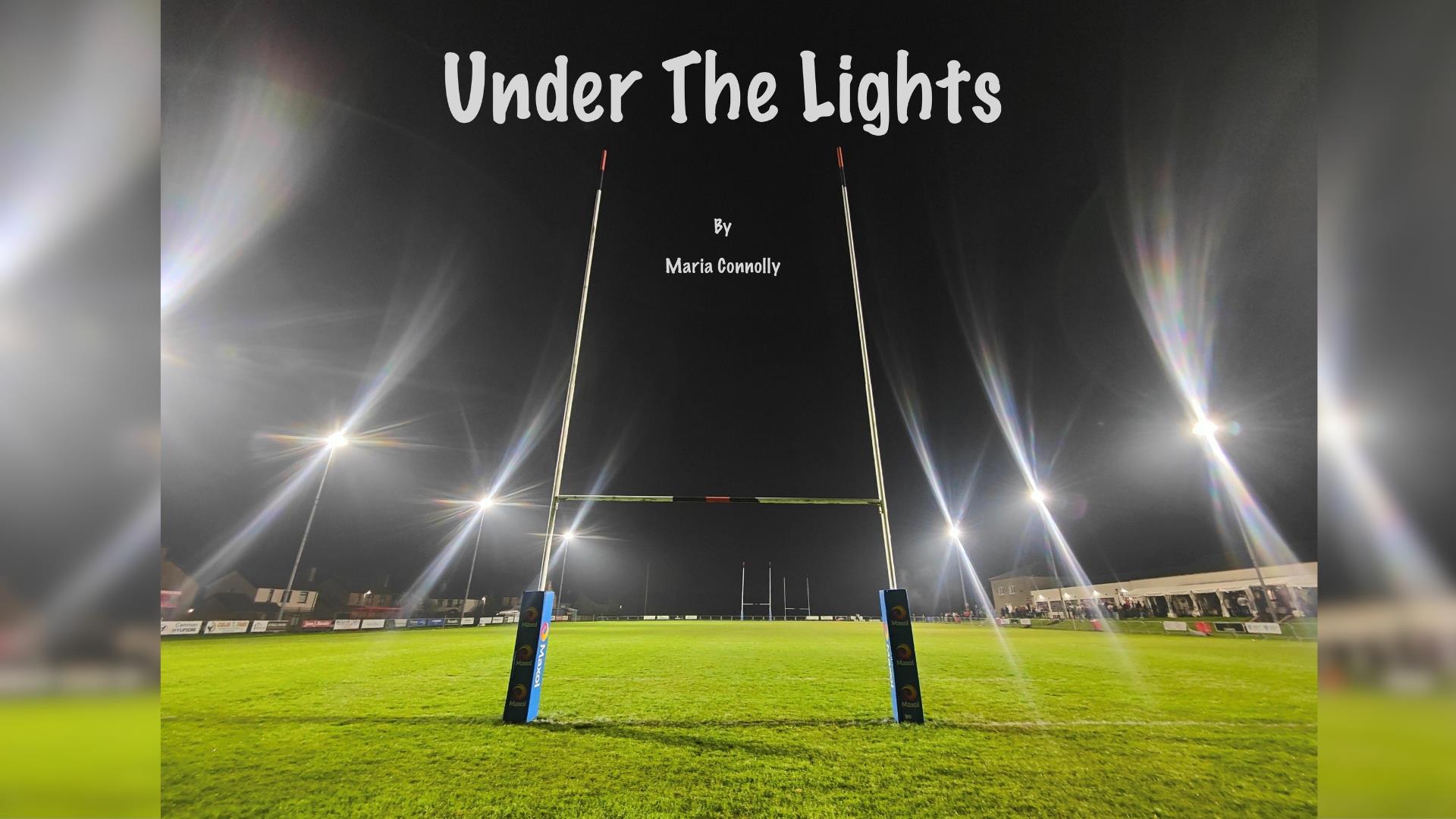 Image showing the goal post at night with the floods turned on. Under the lights by Maria Connolly