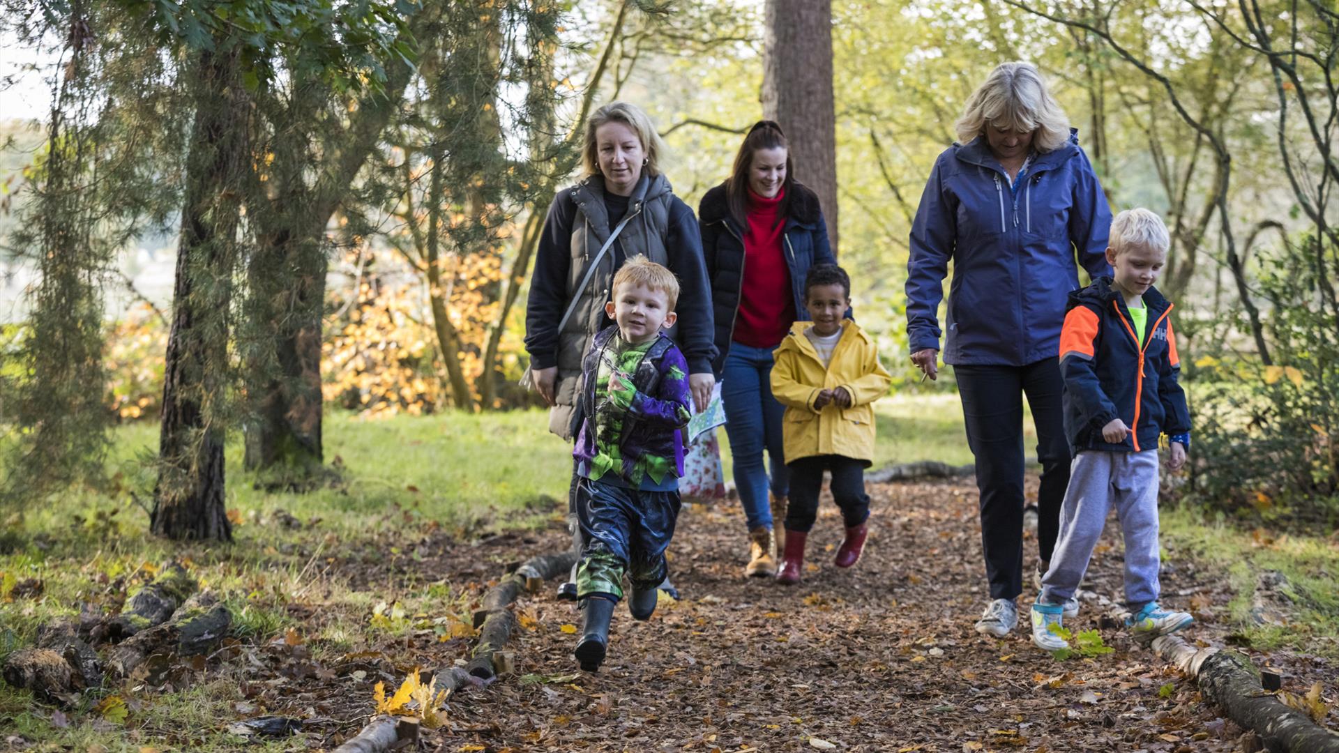 Boy running on Halloween Trail with Family