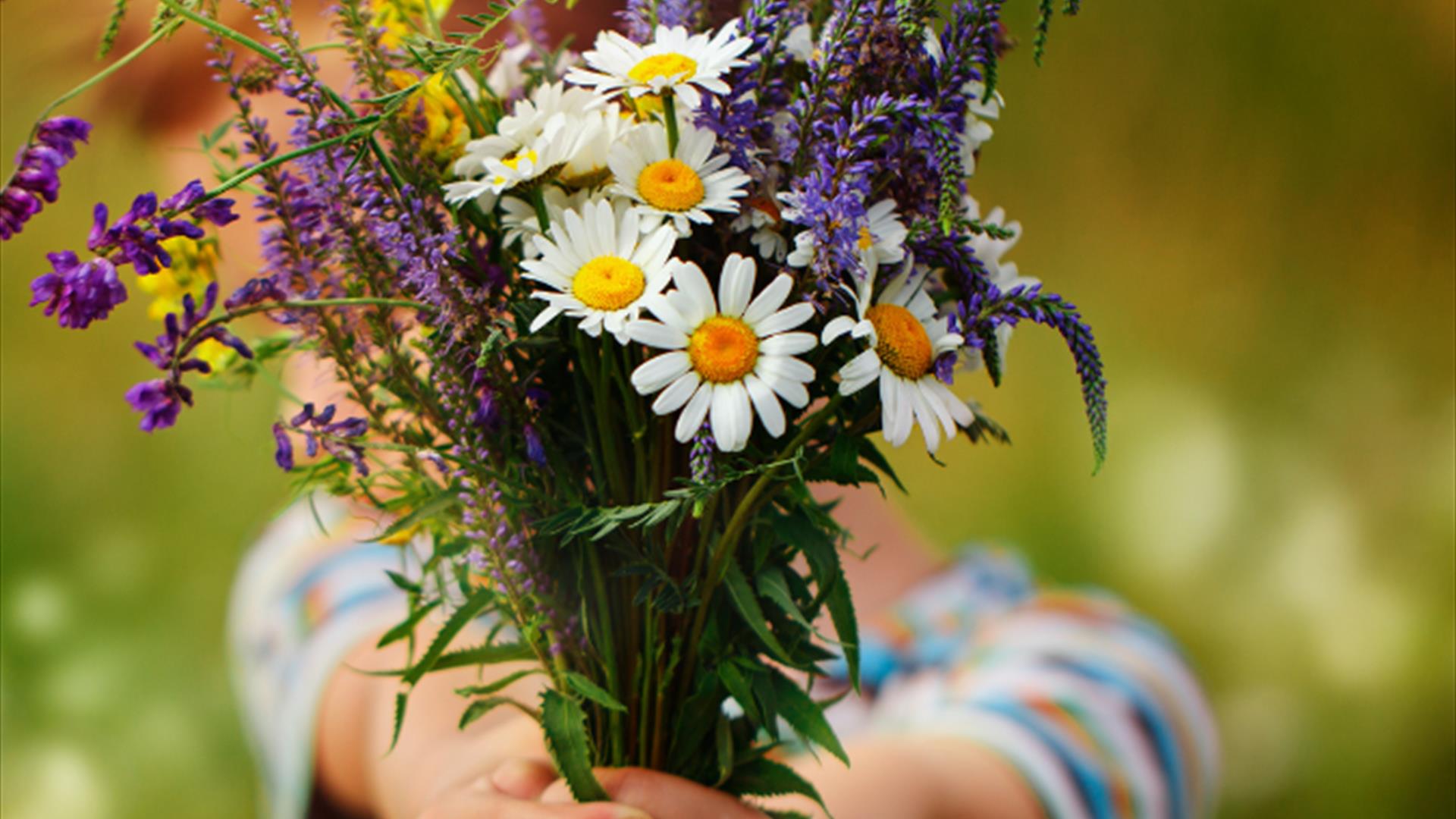 child with bunch of flowers