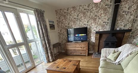 living room with fireplace and tv
