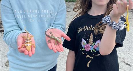 Kids holding lizards