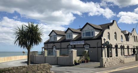 Exterior of the Harbour House Inn on a sunny day