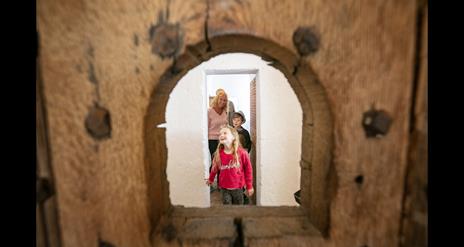 A family exploring the restored cell block