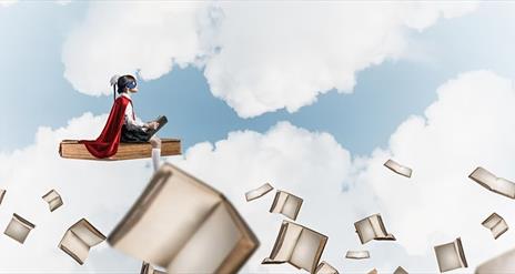 Child exploring books