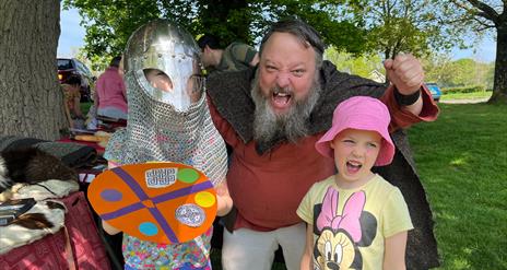 A viking with two children at Delamont Country Park