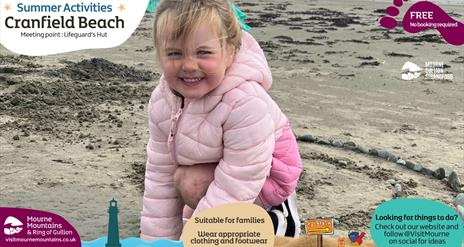 A girl making art at the beach with stones