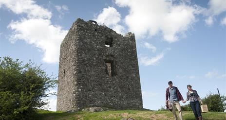 Moyry Castle with people walking