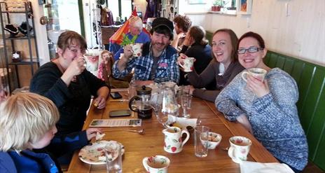 Group of friends at table enjoying food