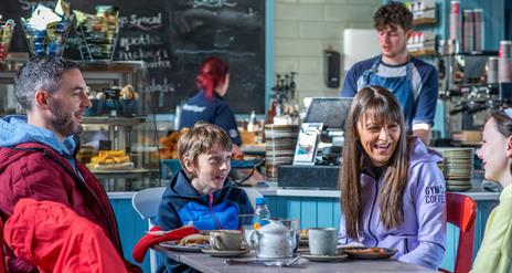 Family of four enjoying breakfast at Synge and Bryne - Kilbroney Park