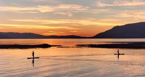 Enjoying the pure bliss of the sunset at Greencastle on the sunset SUP experience