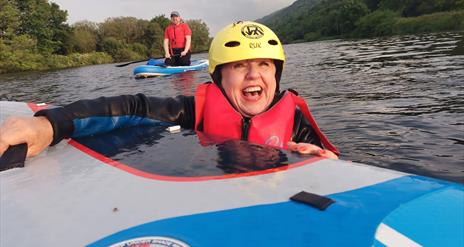 Woman smiling on a great paddle board session - Carlingford Lough