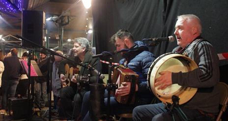 Guitar, Accordion and Bodhrn Drum played by band 'Parcel of Rouges'