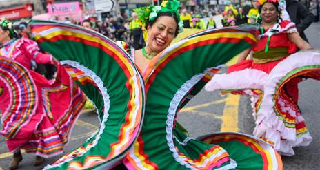 Performers walking down Market Street in Downpatrick as part of the St Patrick's Day parade.