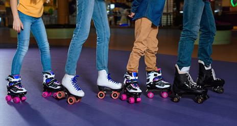 Four children roller skating