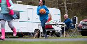 Family of four enjoying at snack outside their caravan