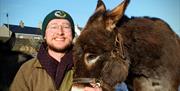 owner Robert and brown donkey
