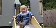 Tom getting ready to slide in Slieve Gullion Adventure Playpark in Slieve Gullion Forest Park