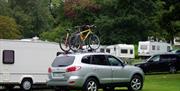 An image showing Caravans and tents pitched at Kilbroney Caravan Park in Kilbroney Park