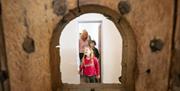 Family exploring restored Gaol cells at Down County Museum
