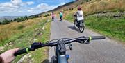 4 people cycling on roads around Slieve Gullion.