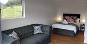 Bed and living space at Oakwood Glamping Mourne Mountains