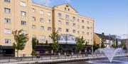 View of the front of the Canal Court Hotel and Spa building, fountain also in the picture.