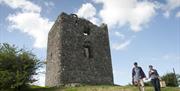 Moyry Castle with people walking
