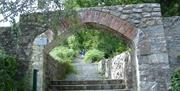 Arch way and steps leading to the Granite Trail
